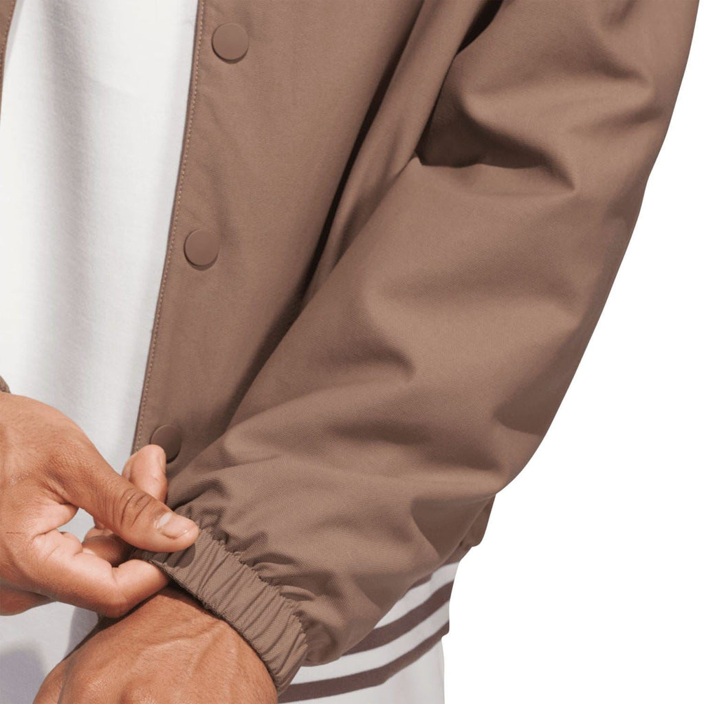 Brown coach overshirt sleeve cuff detail with striped ribbed trim