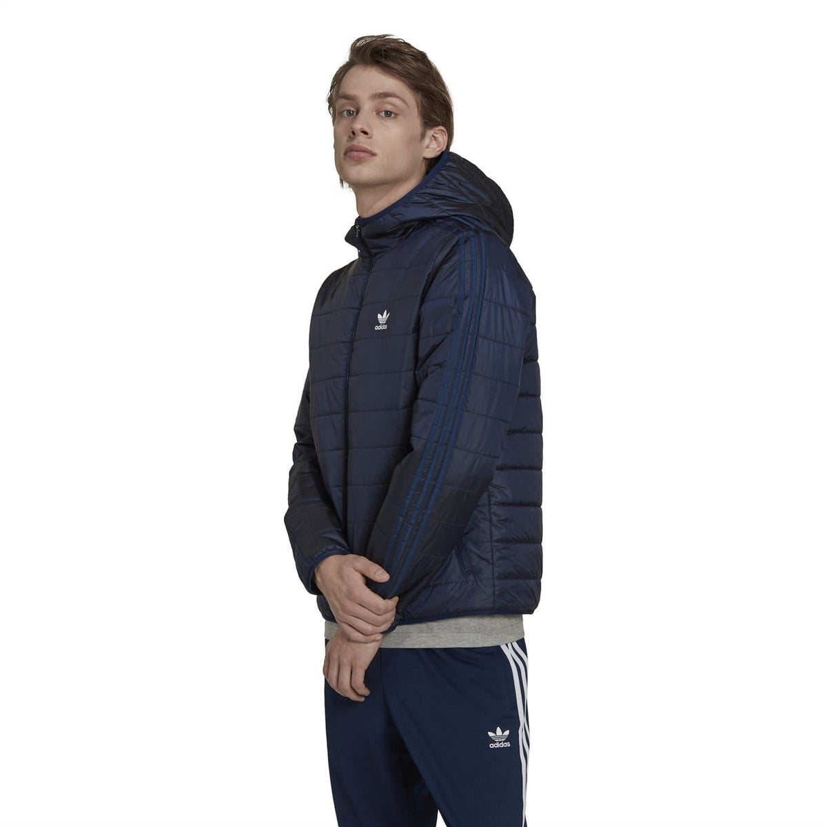 adidas hooded padded jacket in dark navy, side view with small logo and hood