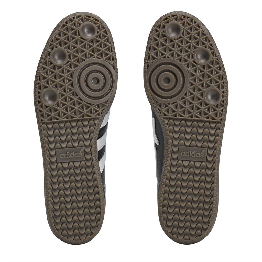 Sandal outsoles showing textured tread patterns and adidas branding