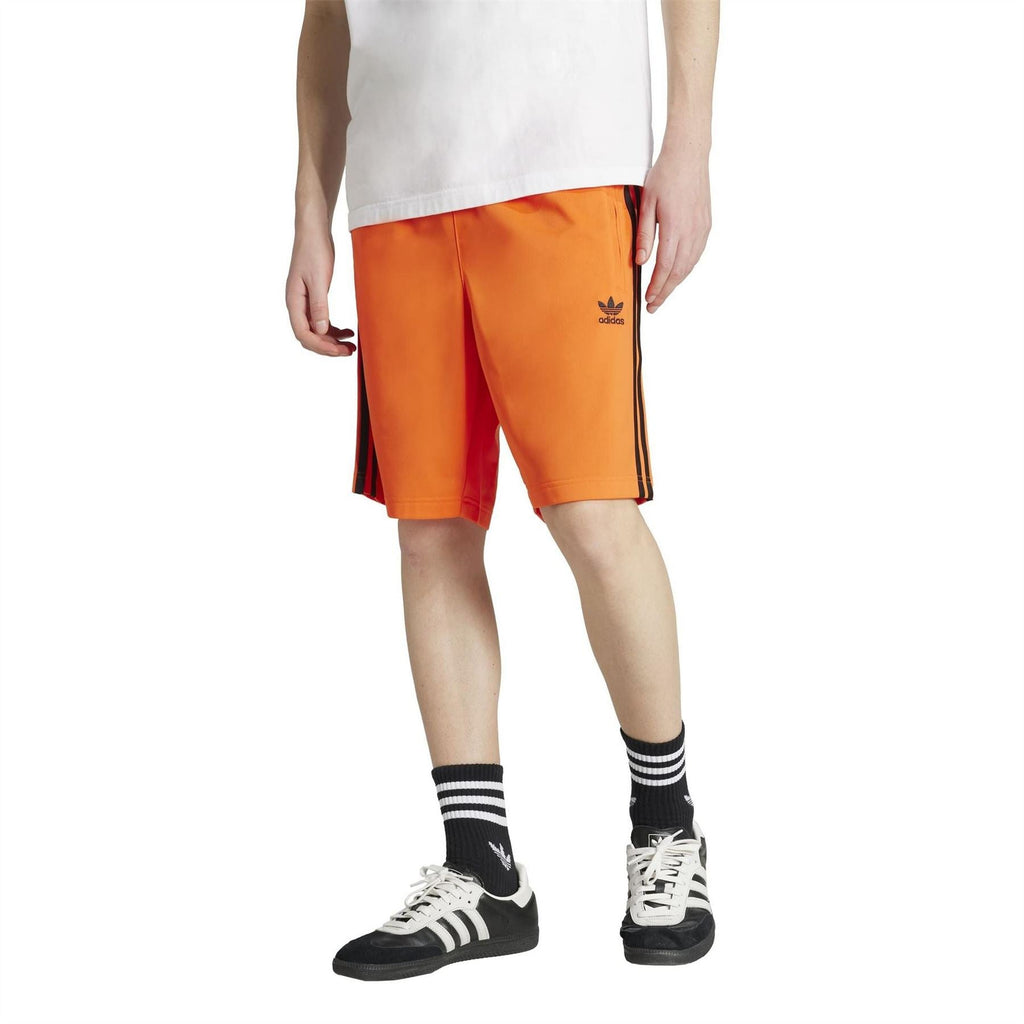 adidas Originals Adicolor Firebird Shorts in vibrant color with elastic waistband and iconic three-stripe design, front view