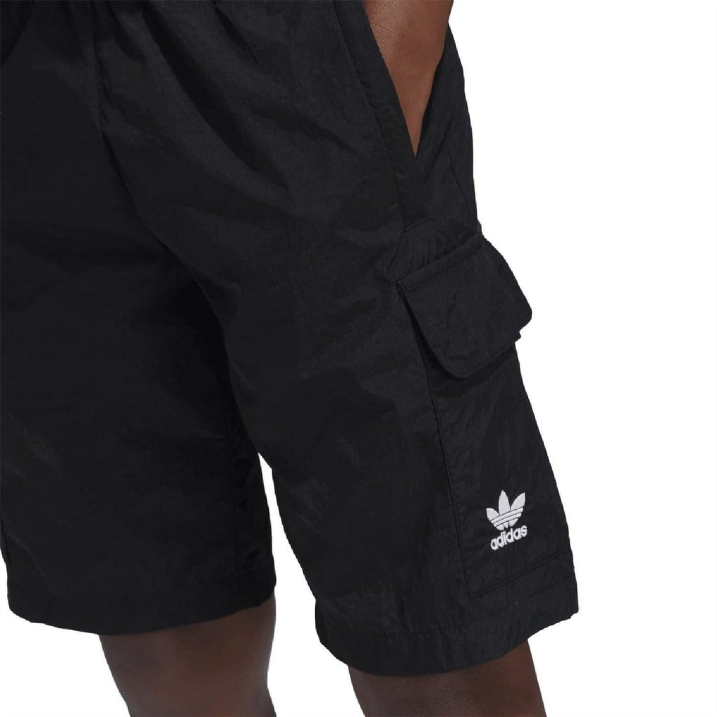 Black cargo shorts with side flap pocket and adidas logo on pocket panel