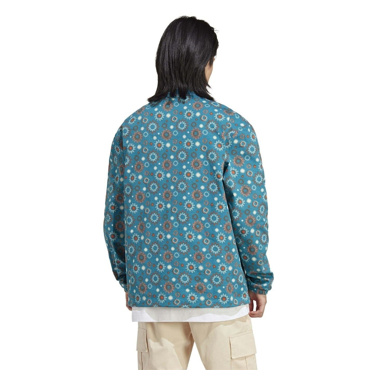 adidas hooded quarter-zip relaxed shirt, back view in teal floral print with logo patch
