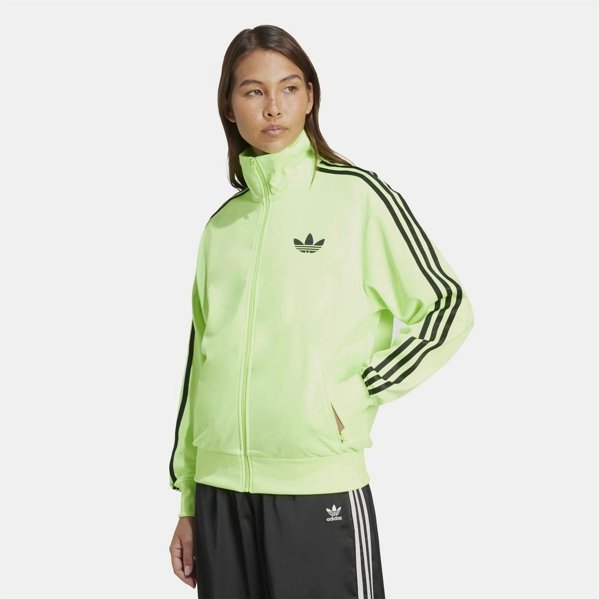 adidas Originals Classic Firebird loose track top sweatshirt in black with iconic 3-stripe design and zip-up front.