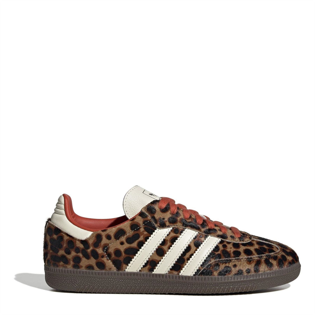 Leopard-print adidas Samba sneakers with white three stripes, red lining, dark rubber sole