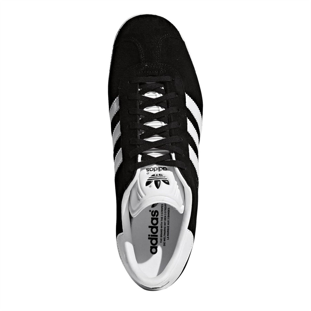 adidas black low-top Gazelle sneakers with white three-stripe accents and lace-up front