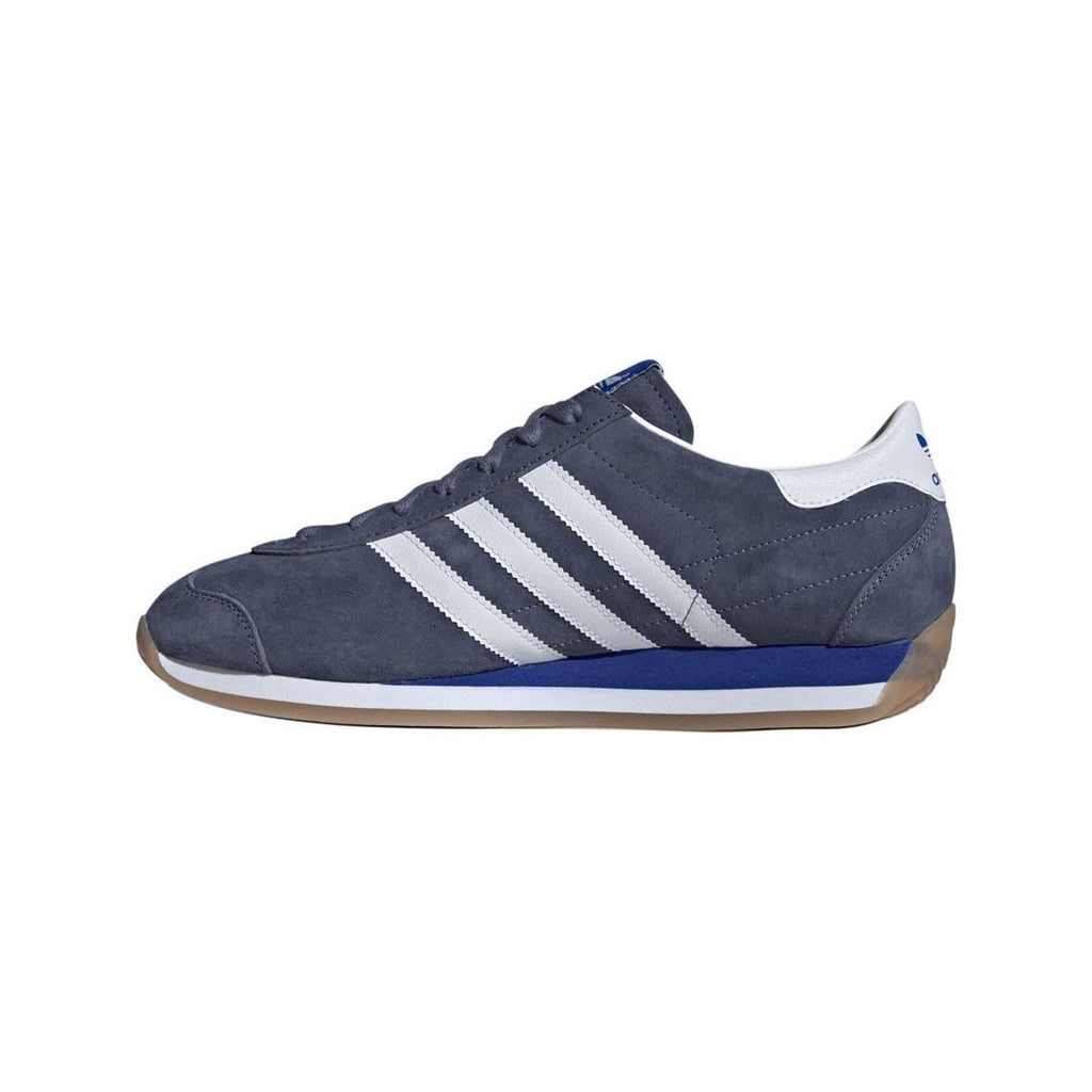 Navy adidas Originals Japan trainers, side view with white stripes and gum-look sole