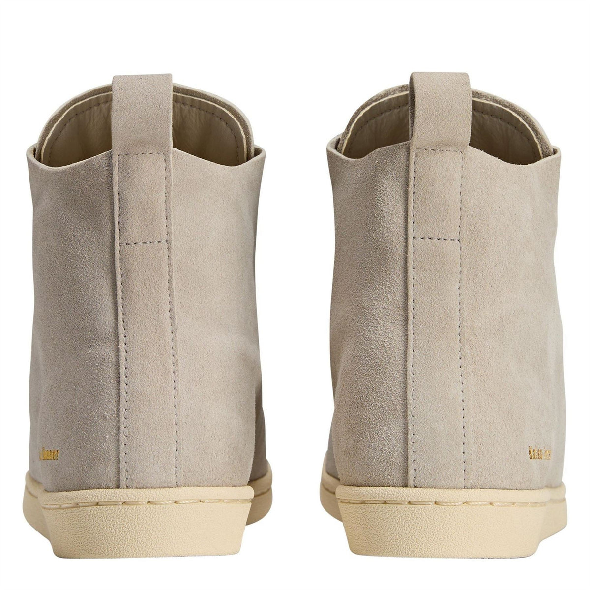 Cream suede high-top sneakers with heel pull tabs and contrast stitching at back.
