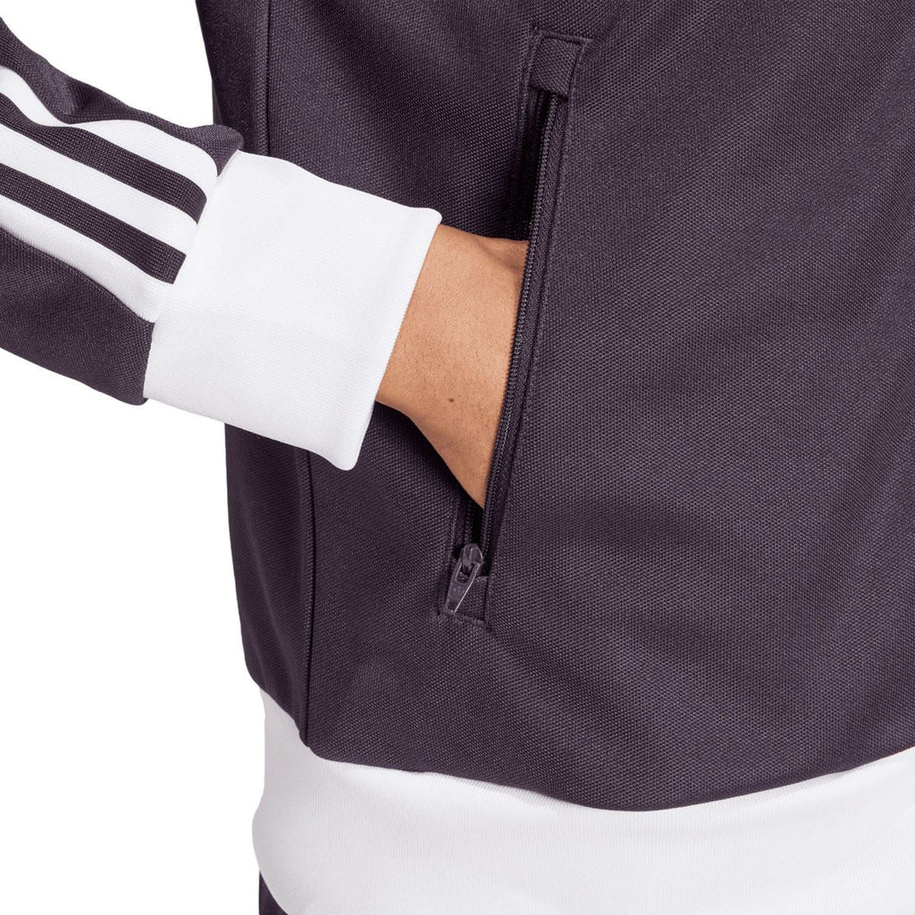 Dark purple track top close-up of full-zip front and zip pocket near the waist