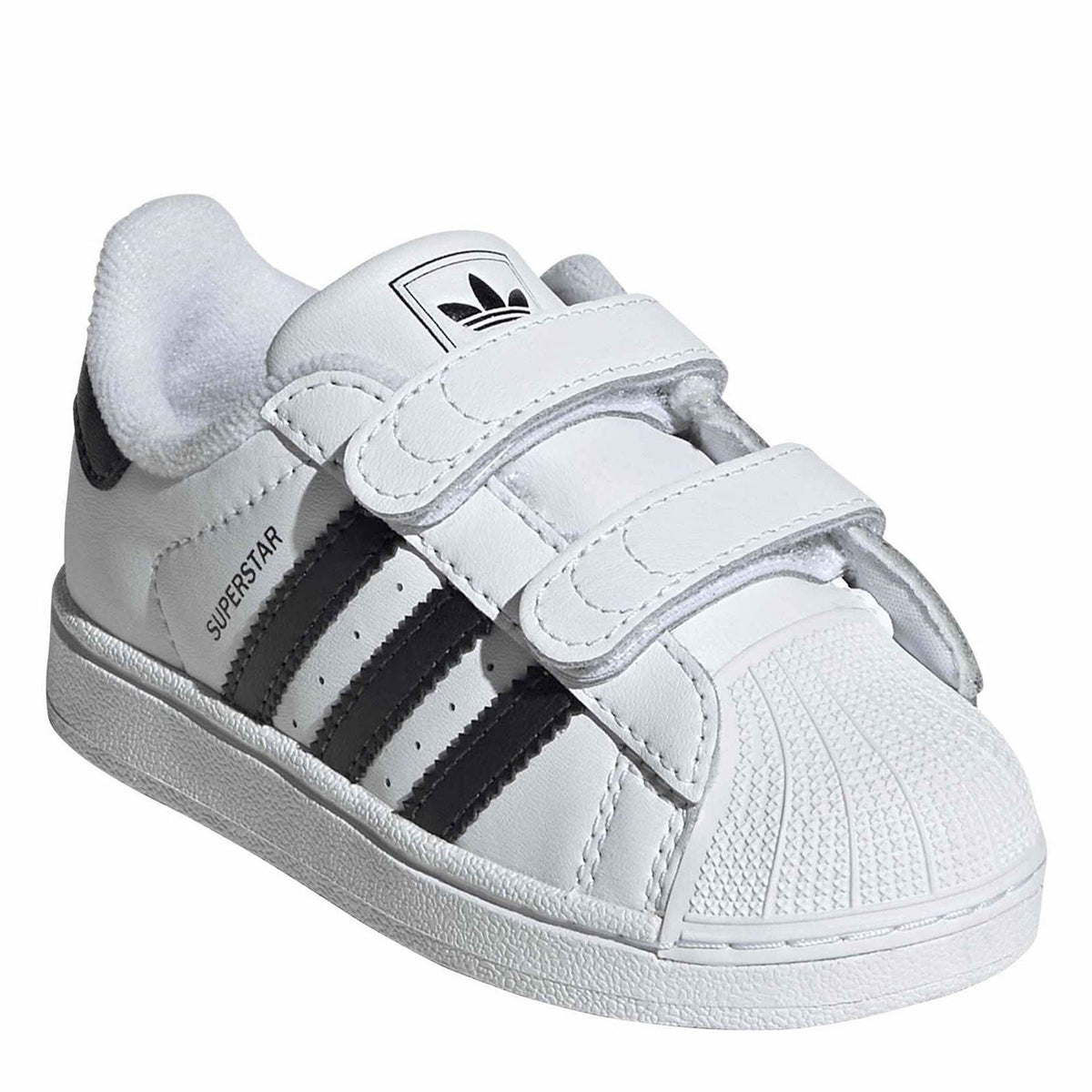 White adidas sneakers with black side stripe, SUPERSTAR text, and double straps