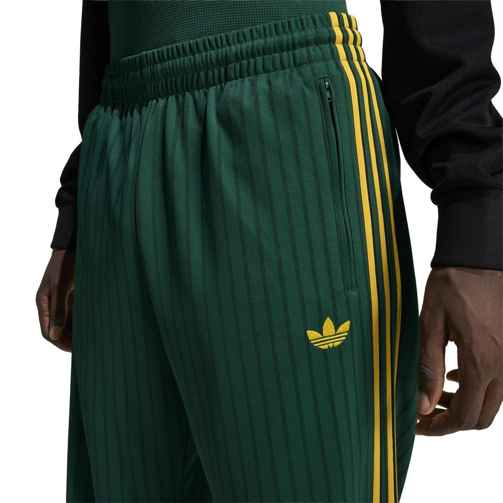 Adidas Originals Firebird track pants close-up of drawstring waist and yellow logo