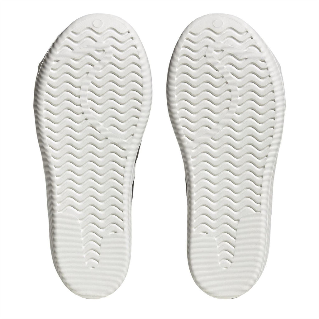 adidas Originals Superstar Slip On Trainers showing white sneakers with classic shell toe design and cushioned sole