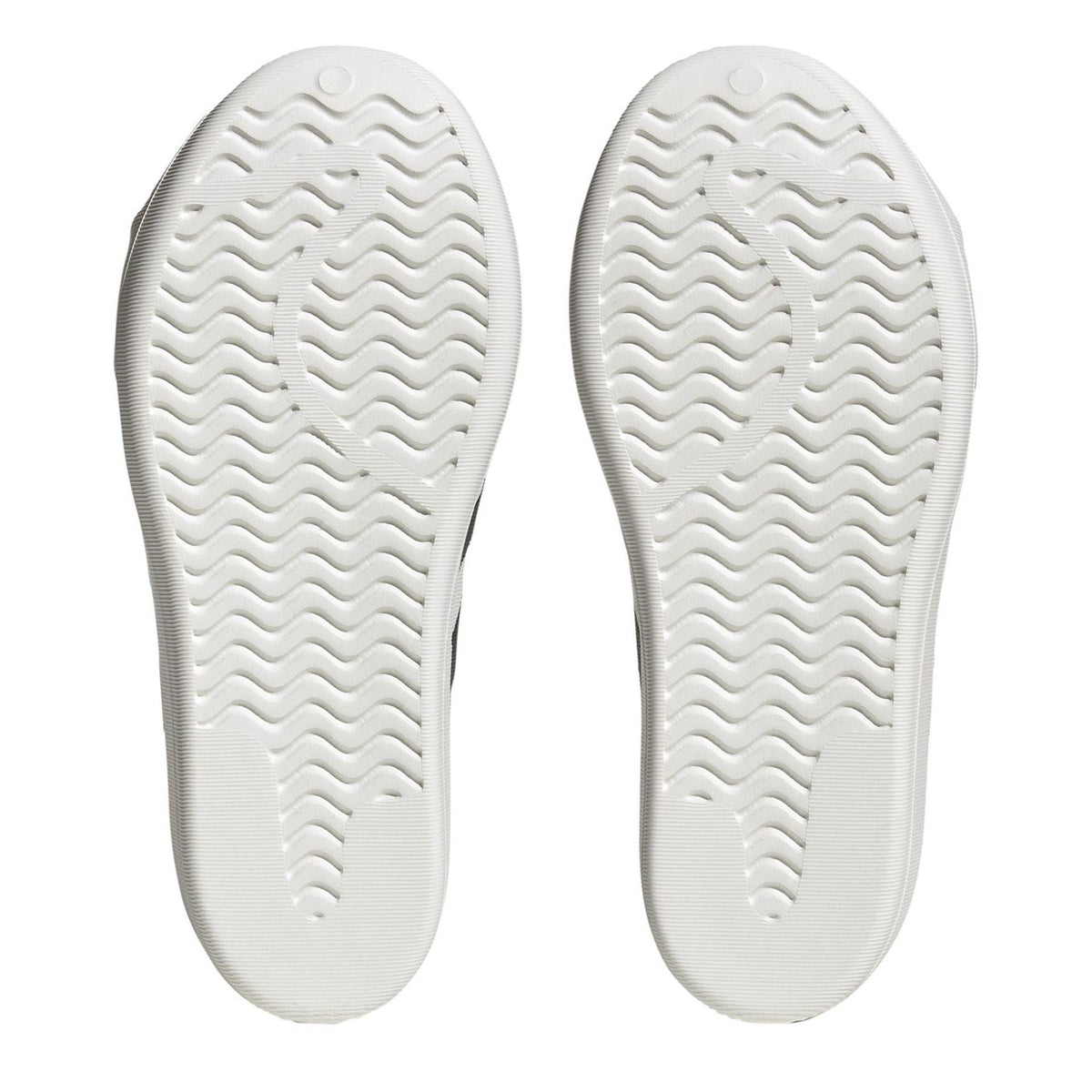 adidas Originals Superstar Slip On Trainers showing white sneakers with classic shell toe design and cushioned sole