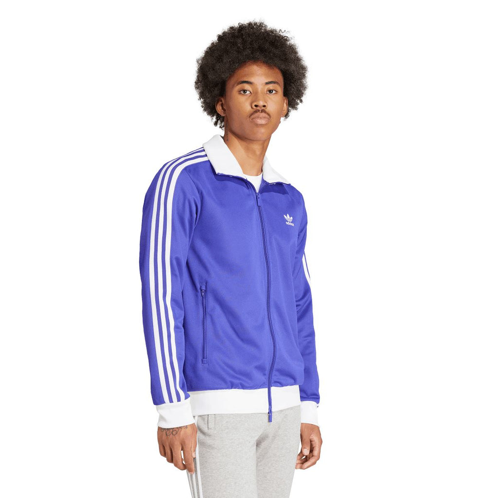 Purple adidas track jacket with white sleeve stripes and chest trefoil logo, full zip