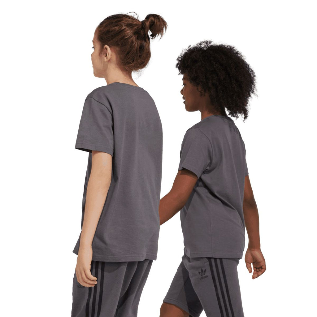 Grey junior T-shirt worn by kids, back view with Trefoil graphic on the upper back.