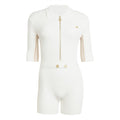 Off-white knit onesie with front gold zipper and ribbed collar, logo on chest