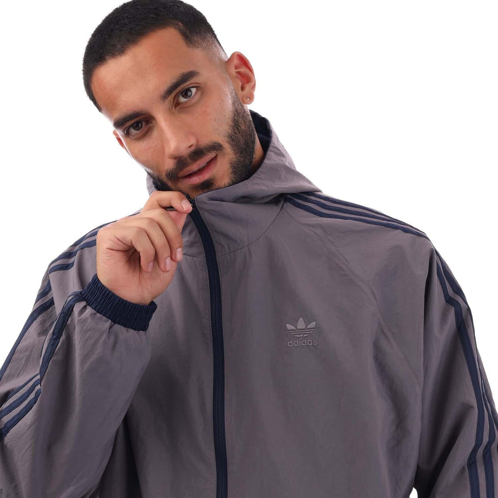 Gray windbreaker with hood and full zip, adidas logo on chest