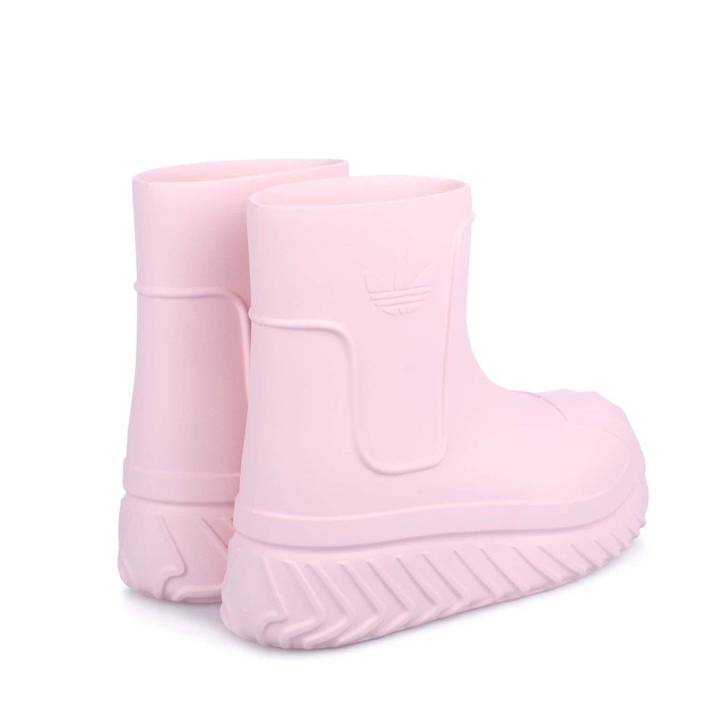 Pink mid-top boots, back view, molded logo patch and chunky ridged sole