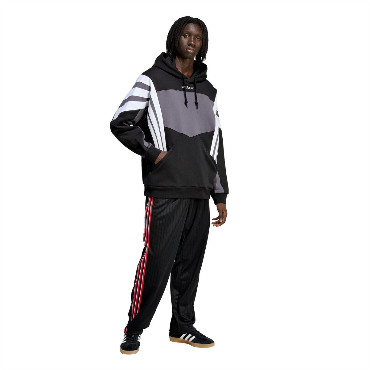 Black hoodie worn with grey paneling and white sleeve stripes, drawstring hood and pocket