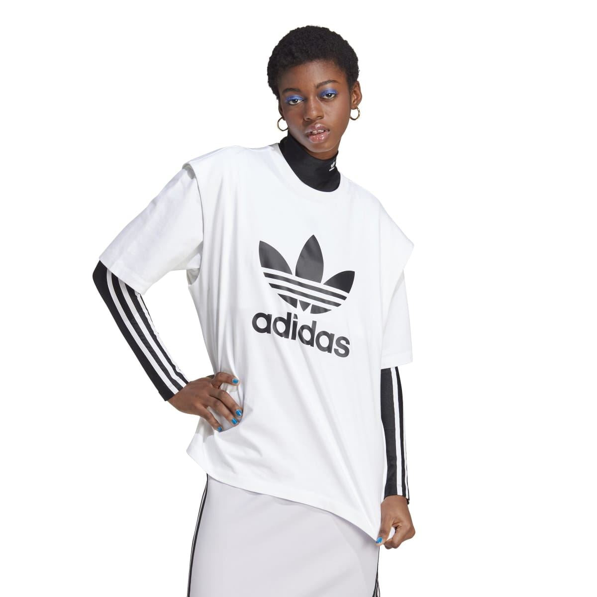 White adidas Originals T-shirt on model with trefoil logo and adidas wordmark front