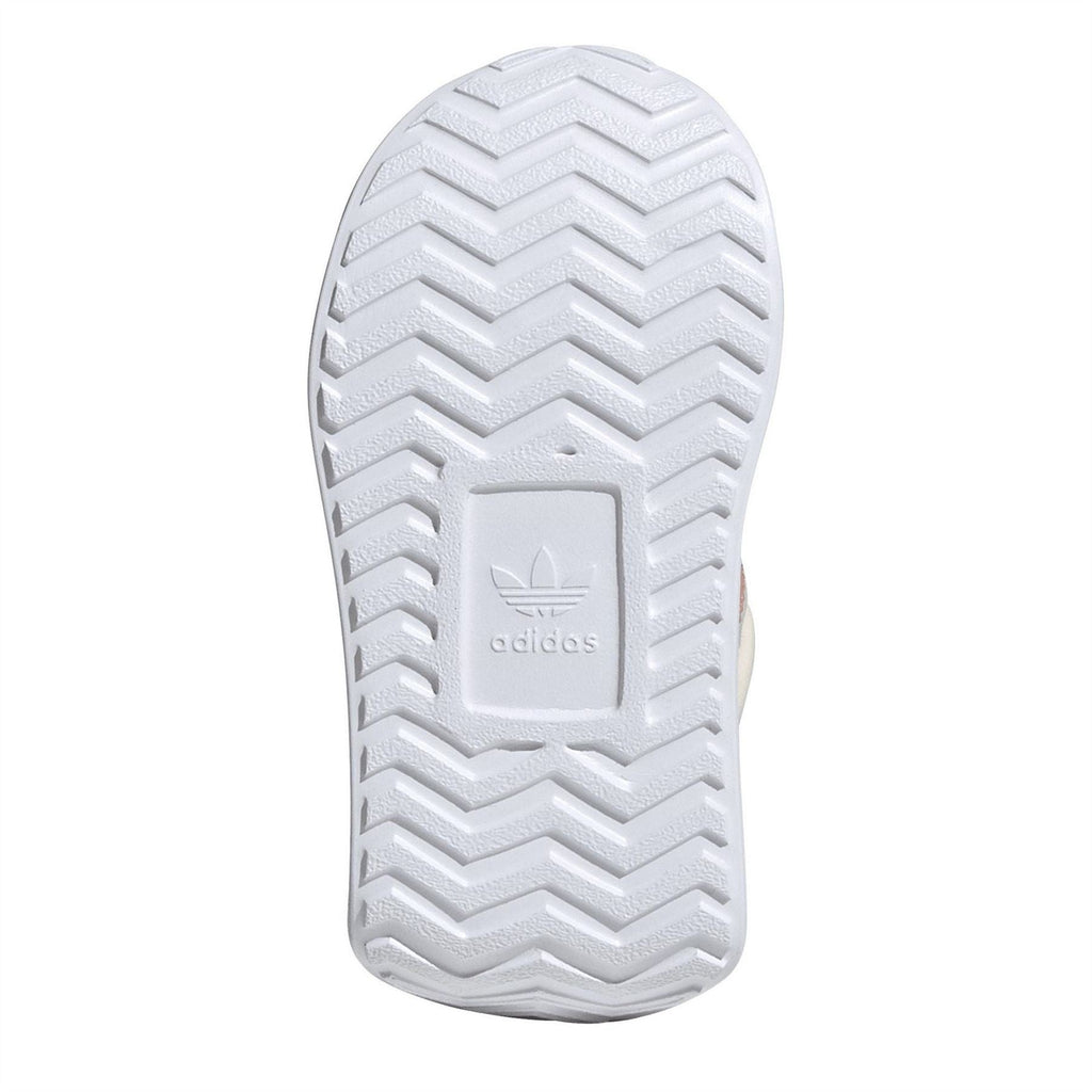 White rubber outsole with zigzag tread pattern and adidas logo