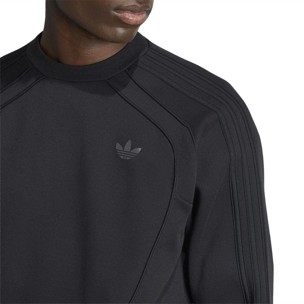 Black adidas Originals crew-neck sweater close-up with ribbed collar and trefoil logo