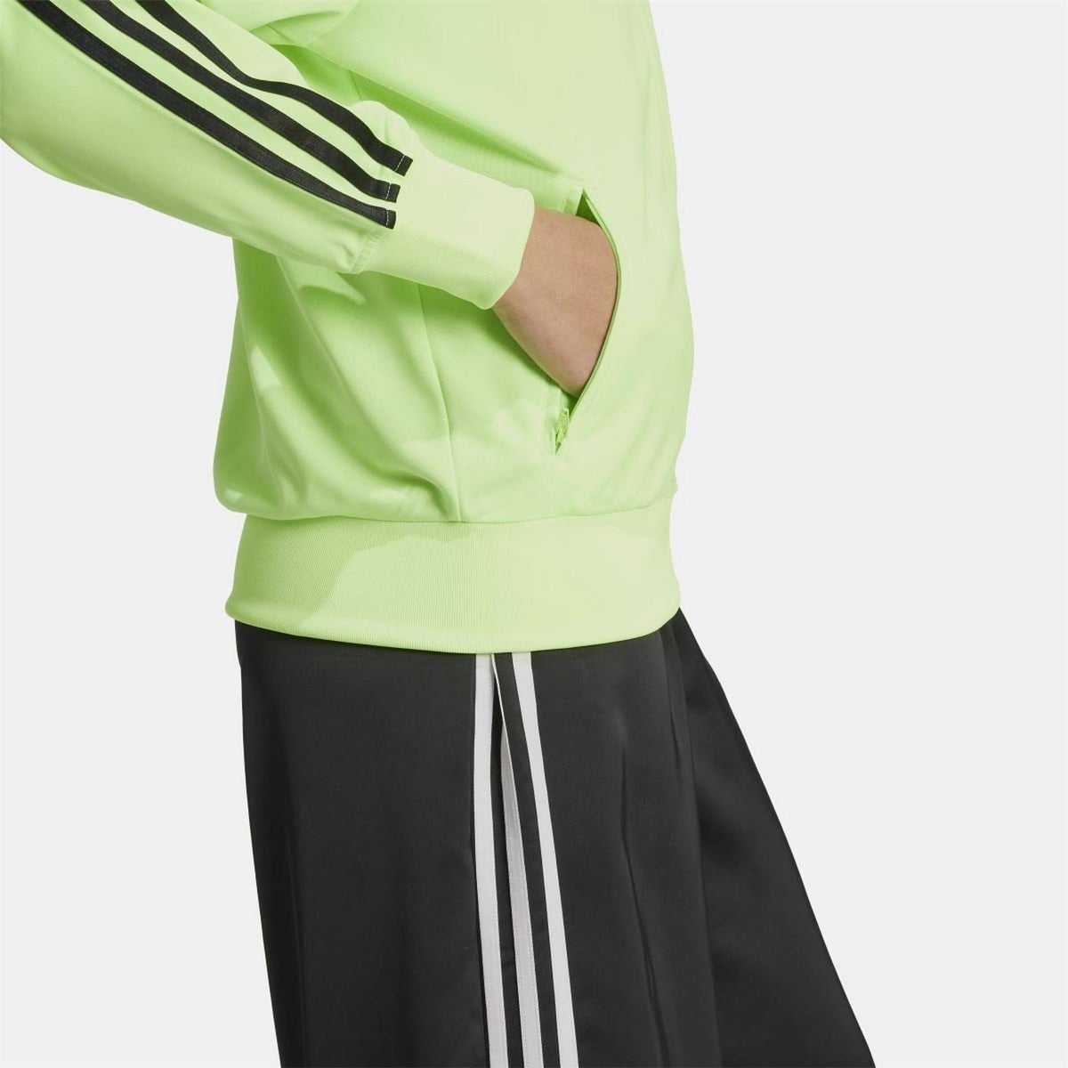 adidas Originals Classic Firebird loose track top sweatshirt with zip-up front and ribbed cuffs, navy blue color.