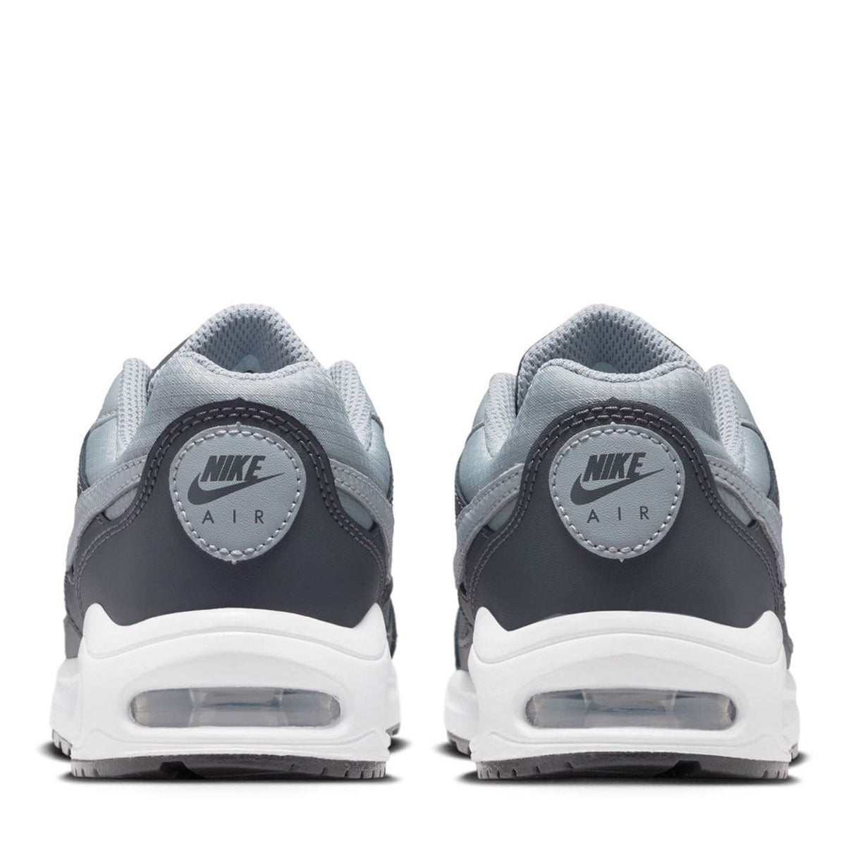 Boys’ dark gray heel view trainers with white sole and Air branding badge