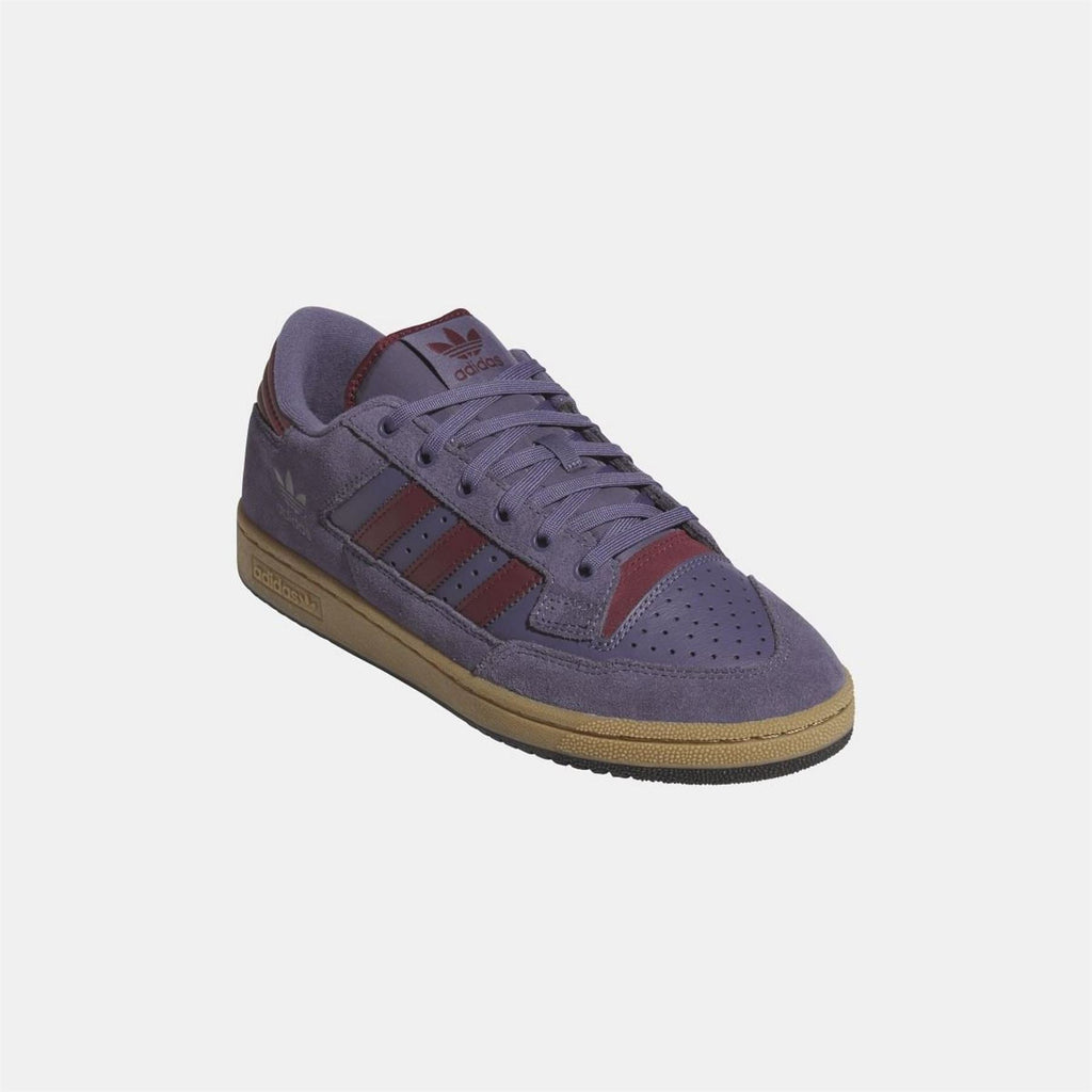 adidas Originals 85 Low ADV sneakers showing classic low-top design and white leather upper with black accents