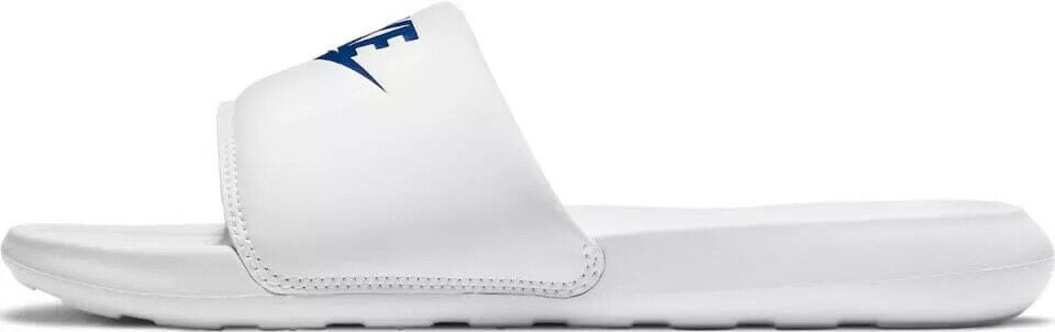 White Nike slide sandals with blue swoosh on front strap, cushioned footbed