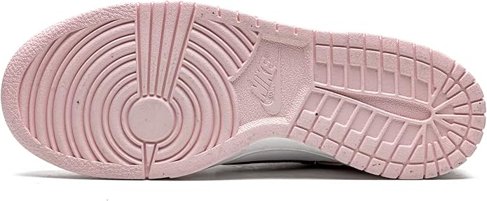 Pink outsole with circular traction pattern and grid tread for low-top sneakers