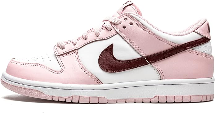 Pink and white low-top sneakers with dark maroon Swoosh and lace-up front