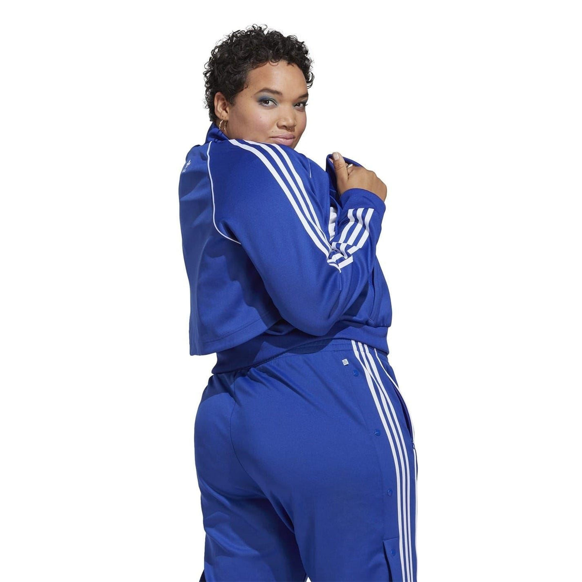 Blue adidas Originals track jacket and pants set with white side stripes