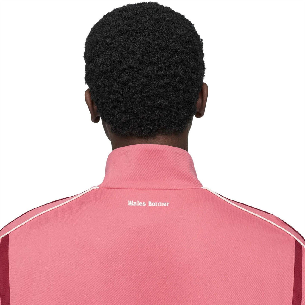 Pink track jacket back collar with Wales Bonner text and adidas-style stripes