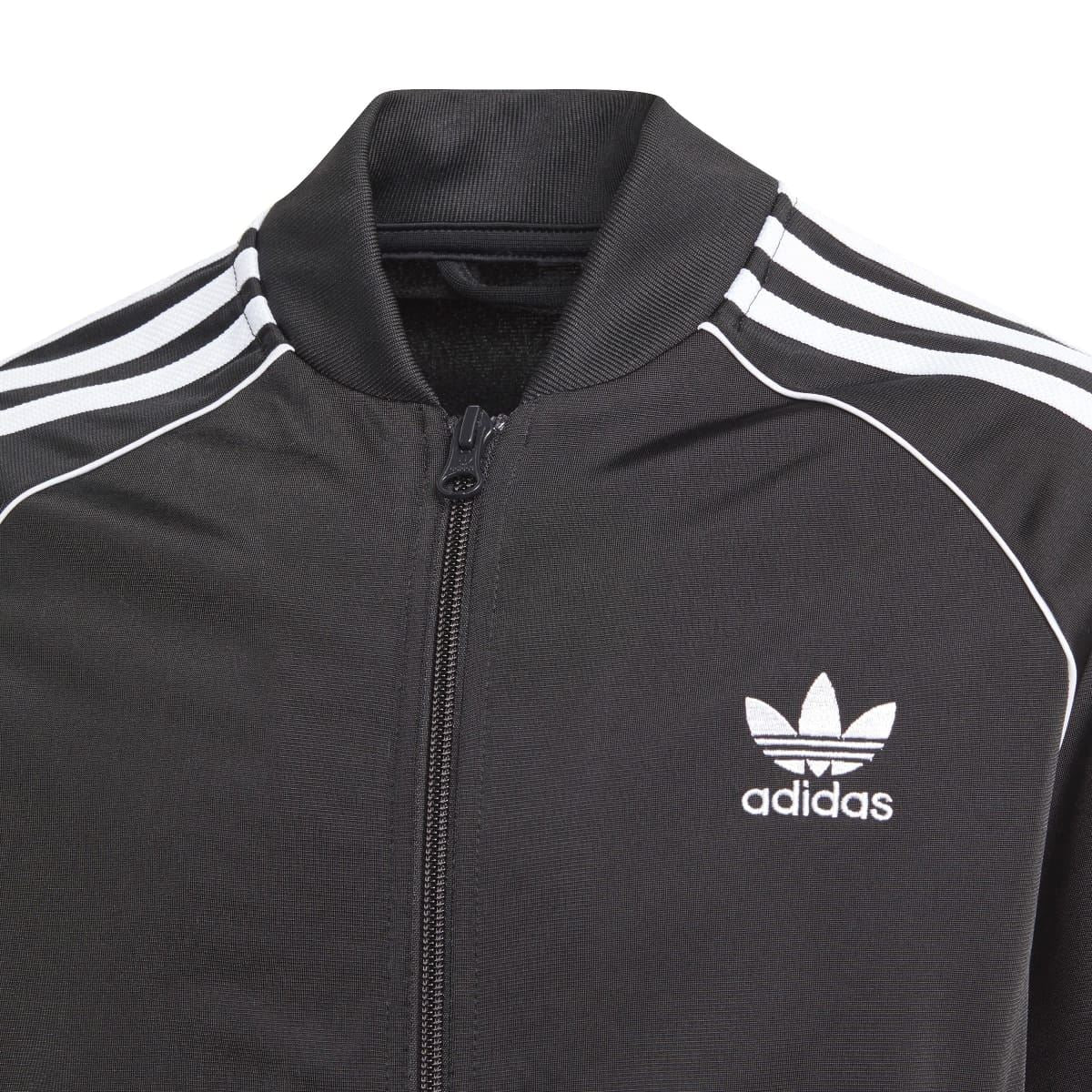 Black adidas juniors track jacket collar with white outline seams and adidas trefoil logo