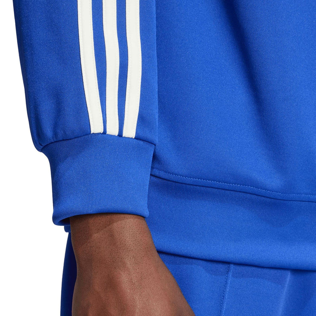 Blue track top sleeve cuff with white triple stripe detail and knit rib hem.