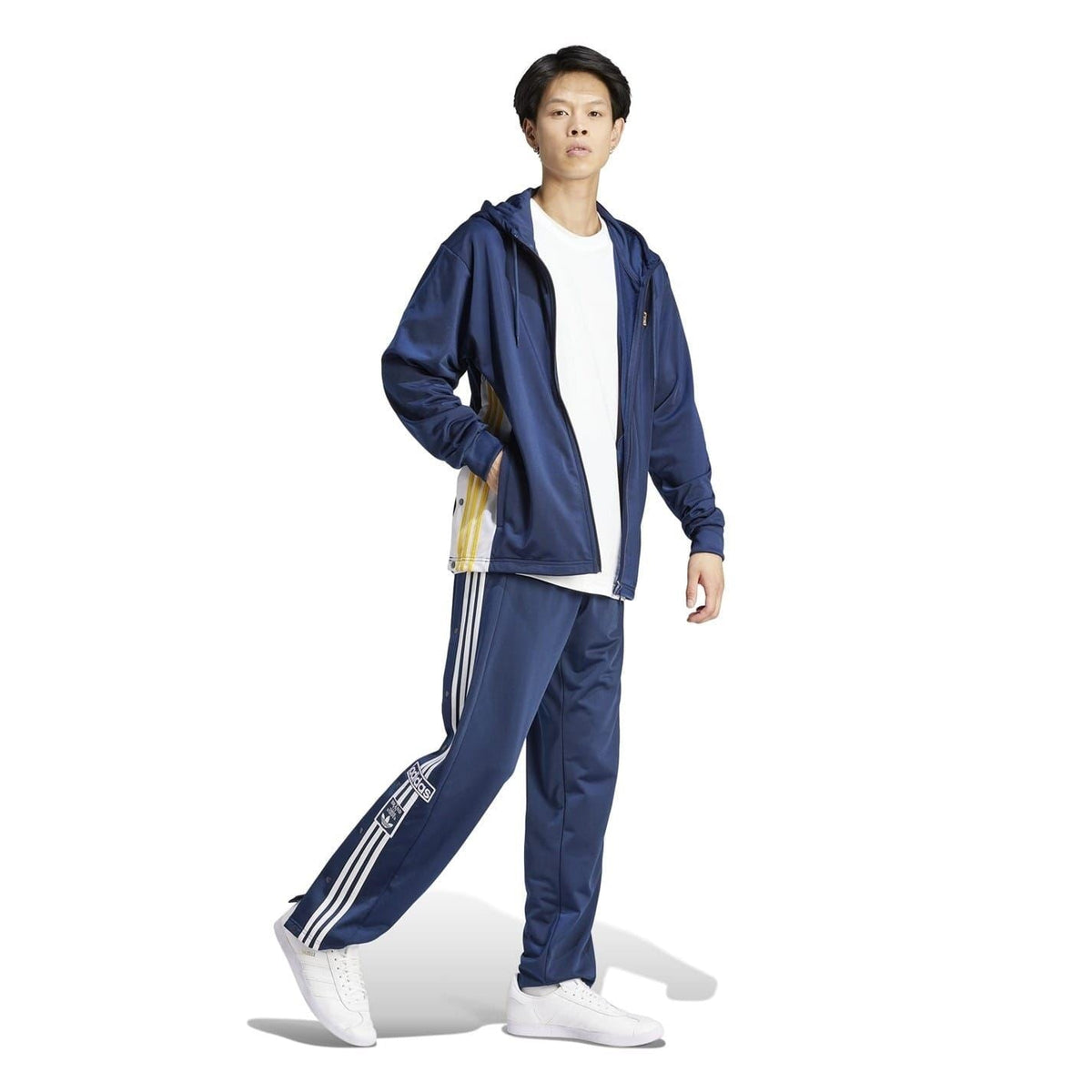 Dark blue hooded track jacket with front zip, side pockets, and drawcord hood