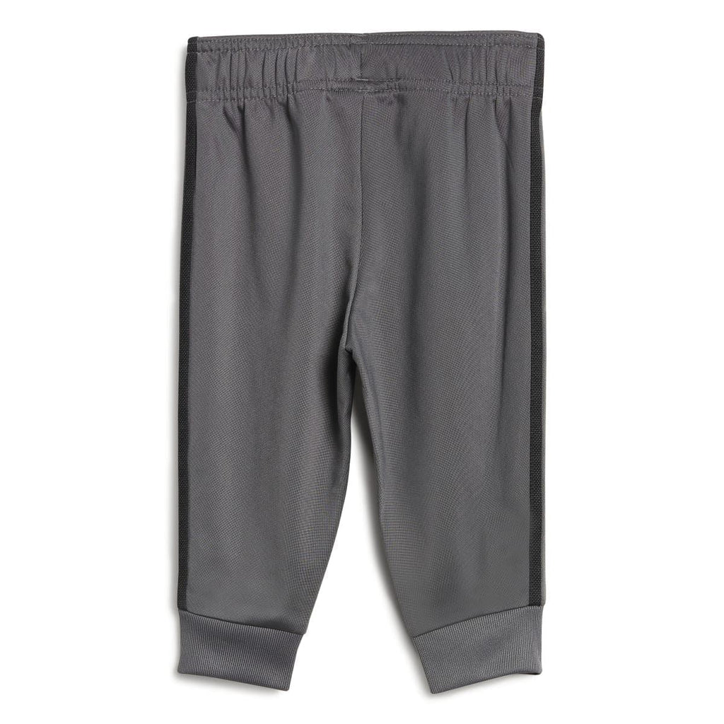 Grey adidas infants track pants with elastic waistband, side stripes, and ribbed cuffs