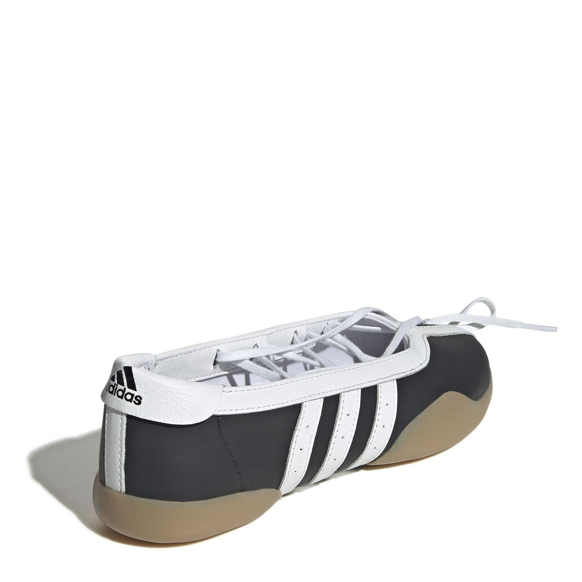 Taekwondo sneakers with adidas logo on heel, black-and-white stripes, tan gum sole
