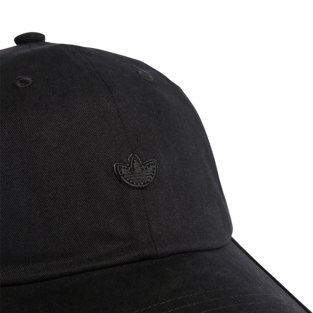 Black cap crown close-up with embroidered adidas trefoil logo and stitching