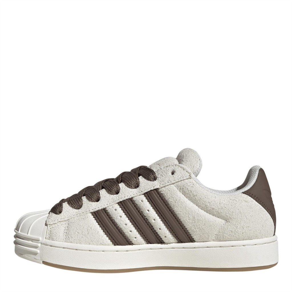 Off-white low-top sneakers, side view with brown laces and three patent-style stripes.