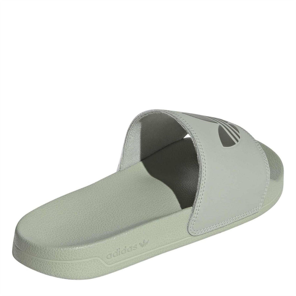 adidas Originals Adilette Lite open-toe logo print slides showing navy blue slides with white adidas logo and slip-on design