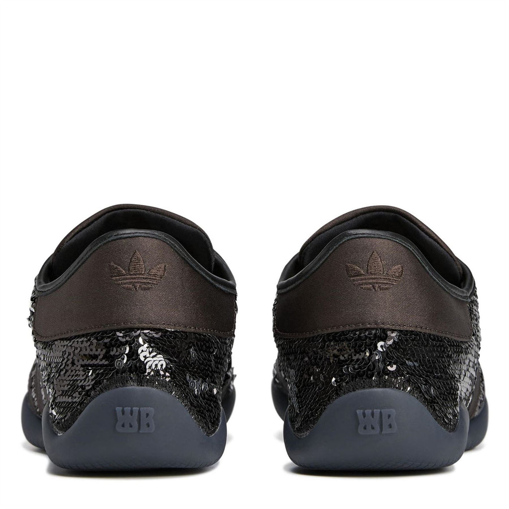 Back view sequin sneakers with adidas and WB logos on heel, dark rubber sole