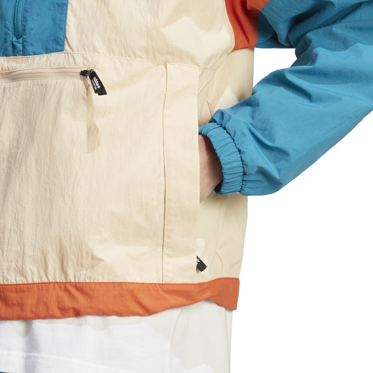 adidas Originals windbreaker jacket close-up of front pocket zip and sleeve cuff