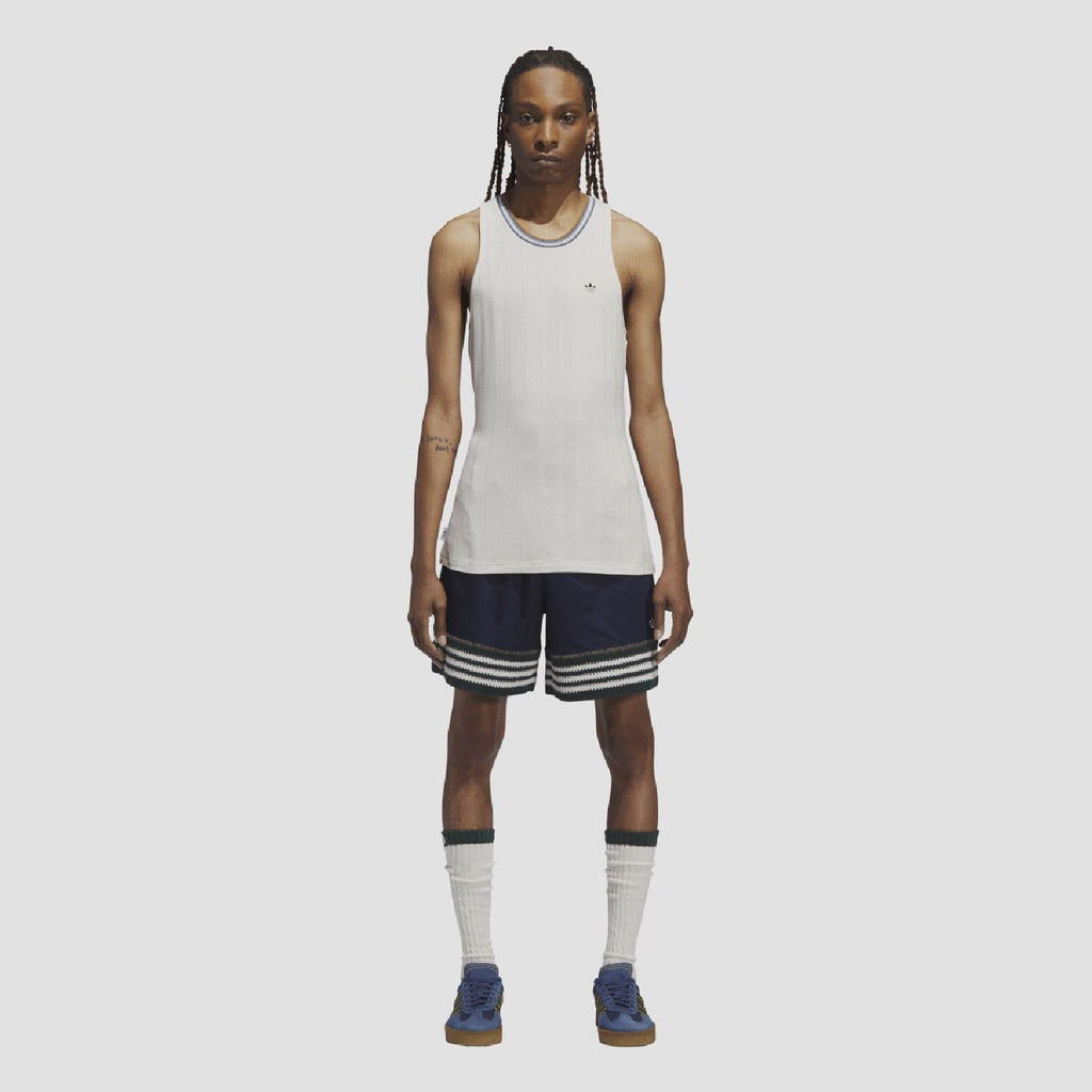 Indigo knit shorts with elastic waistband, striped hem and small trefoil logo