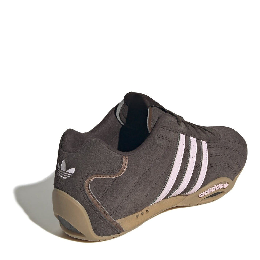 Dark brown low-top sneakers with adidas heel logo, three stripes, and gum sole