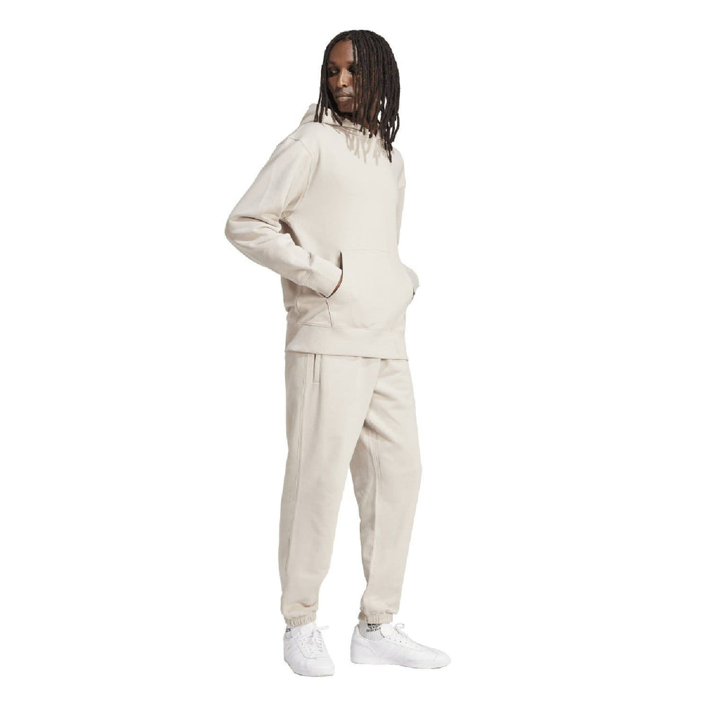 Beige hoodie with small stitched logo on left chest