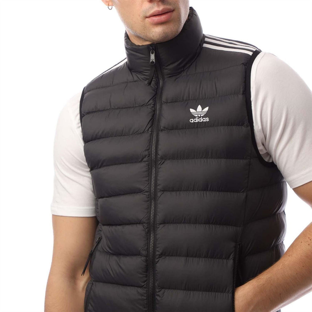 Black padded vest with stand collar zip and adidas trefoil logo on chest.