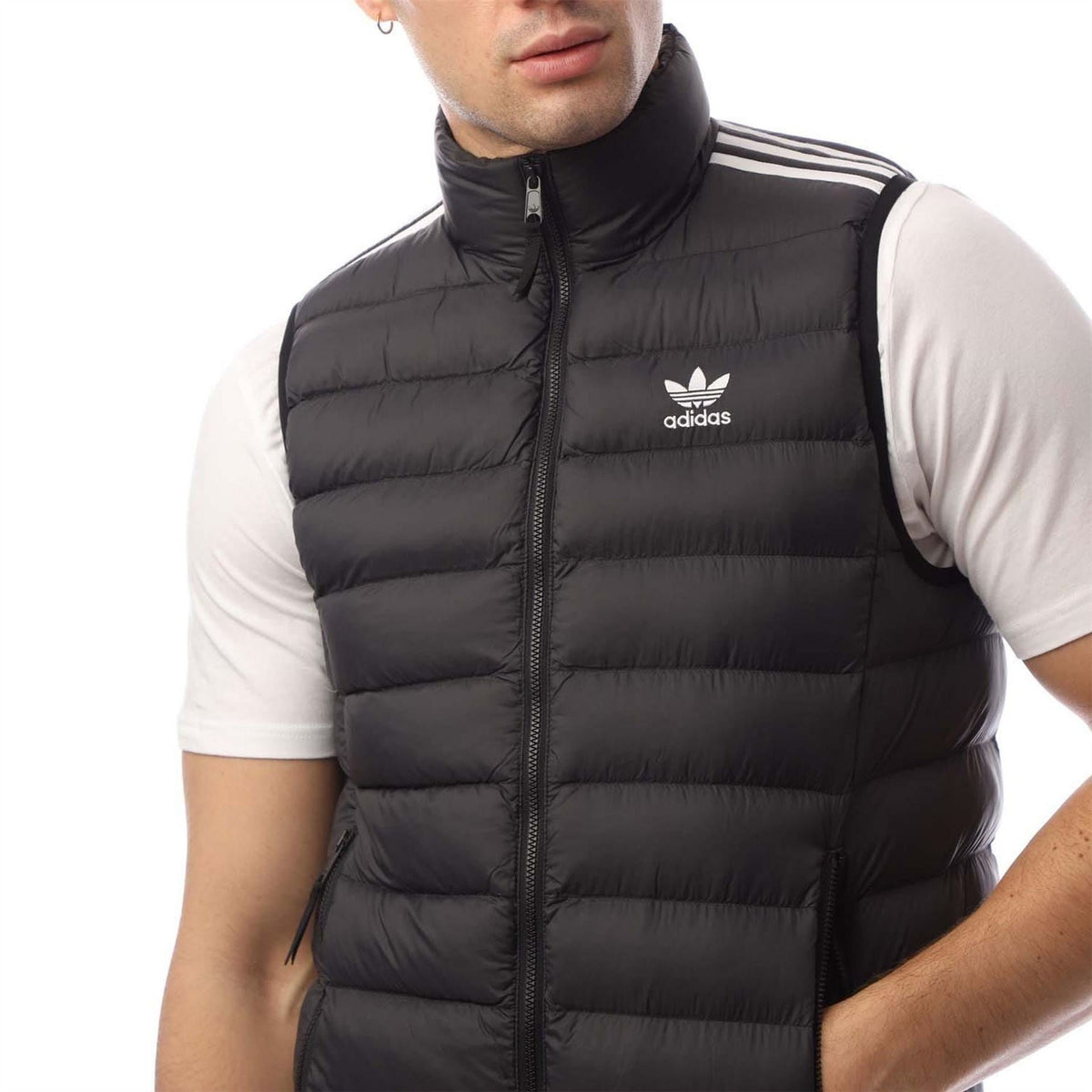 Black padded vest with stand collar zip and adidas trefoil logo on chest.