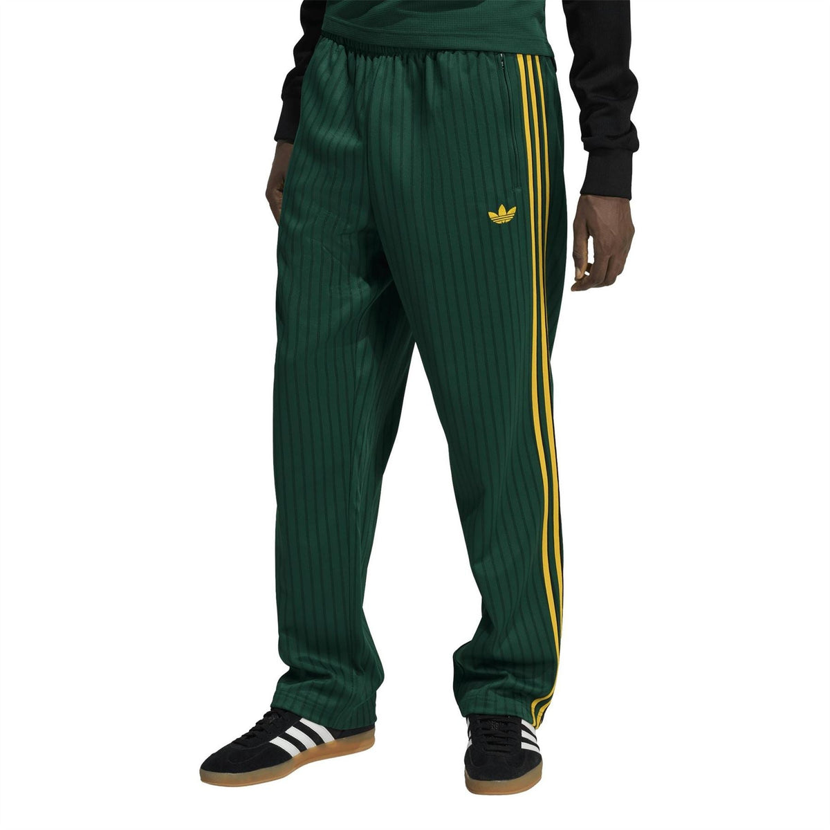 Adidas Originals Firebird track pants with elastic waist and yellow stripe detail