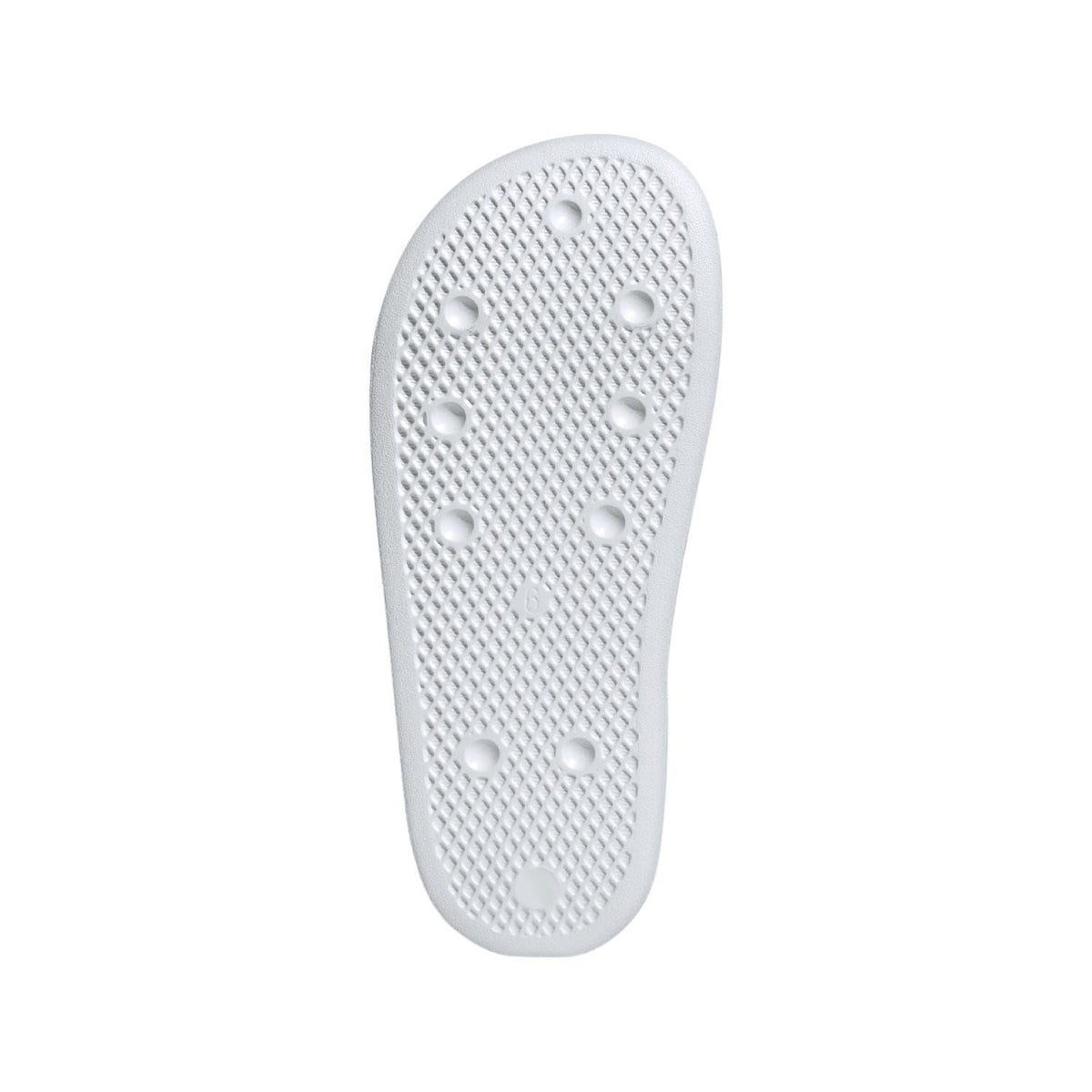White adidas slide sandal outsole with textured nubs for grip